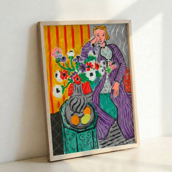 Matisse-inspired wall art print showing a figure draped in purple with dynamic, curving forms and blooming anemone flowers in rich jewel tones.