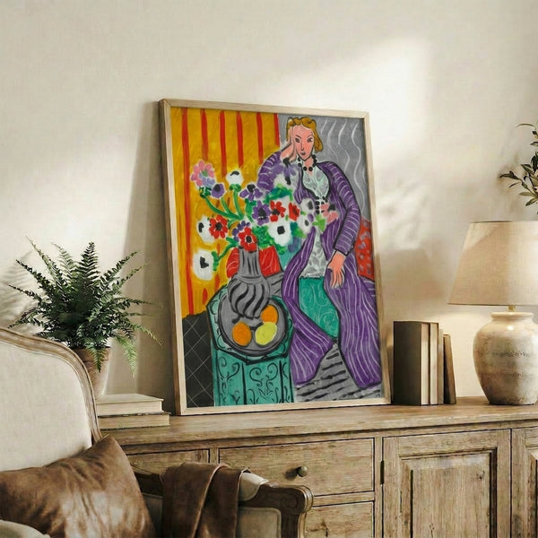 Abstract wall print featuring a purple-robed figure amid energetic, colorful anemone blossoms rendered in expressive, fluid brushwork.