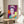 Regal portrait of Queen Elizabeth II rendered in pop art style with brilliant jewel-tone hues and dramatic color separation throughout the composition.