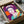 Queen Elizabeth II depicted in colorful pop art style with contrasting bold tones and contemporary artistic treatment, hung as a framed decorative print.