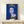Framed pop art poster of Queen Elizabeth II rendered in striking blue hues with simplified forms and repetitive graphic elements from the Reigning Queens series.
