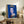 Contemporary pop art print showcasing a queen's portrait in rich blue coloring with graphic simplification and high-impact visual style, framed for gallery-like display.