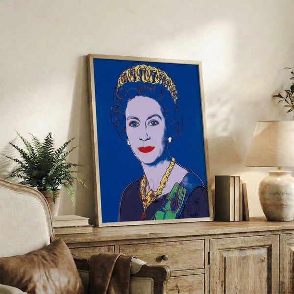Contemporary pop art print showcasing a queen's portrait in rich blue coloring with graphic simplification and high-impact visual style, framed for gallery-like display.