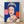 Pop art portrait of Queen Elizabeth II in vibrant blue tones, featuring bold graphic styling and minimal facial detail characteristic of Warhol's Reigning Queens series, framed as a modern art print on a gallery wall.