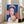 Modern art print showcasing Queen Elizabeth II as a pop art subject with cool blue hues and graphic portrait technique, displayed framed on an interior wall.
