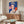 Framed contemporary art print featuring Queen Elizabeth II rendered in bold blues through pop art techniques, emphasizing color and form over realistic detail.