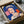 Pop art wall poster of Queen Elizabeth II in striking blue palette with flattened, abstract portraiture style inspired by 1970s silkscreen fine art printmaking.