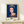Minimalist pop art framed poster in dark blue palette with white and gold highlights, depicting an iconic royal figure in mass-produced elegance style.