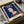 Dark blue pop art framed print with white and gold accents, presenting a bold, iconic portrait in contemporary minimalist style on a wall.