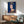 Contemporary pop art framed poster featuring Queen Elizabeth II with flattened forms and striking dark blue palette, high-contrast color blocking throughout.
