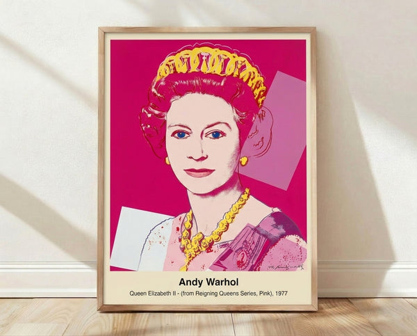 Bold pop art portrait of Queen Elizabeth II in vibrant pink and magenta tones with black outlines, inspired by Warhol's iconic style, framed on a wall.