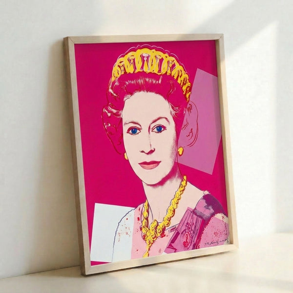 Framed pop art print of Queen Elizabeth II rendered in bright pink and complementary colors, exemplifying Warhol's famous repetition and bold color techniques.