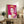 Contemporary pop art portrayal of Queen Elizabeth II in striking pink shades, part of Warhol's celebrated Reigning Queens series, mounted as wall art.