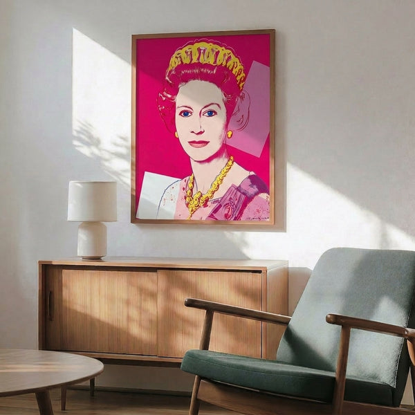 Bold silkscreen-inspired portrait of Queen Elizabeth II in luminous pink, showcasing Warhol's signature pop art style and royal iconography as a framed print.
