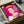 Warhol-style pop art rendering of Queen Elizabeth II featuring vivid pink coloring and iconic silkscreen techniques, presented as a modern wall poster.