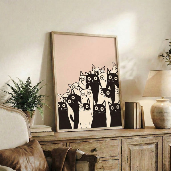Contemporary framed art print with a quirky parade of minimalist cats rendered in black line art against cream and tan tones.