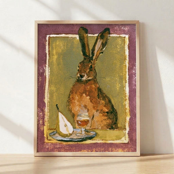 Whimsical watercolor folk art depicting a hare holding a wine glass beside a pear, rendered in warm olive, russet, and sage tones with cottagecore charm, displayed as a framed poster on a wall.
