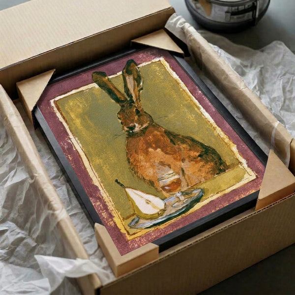 Whimsical cottagecore watercolor artwork featuring a hare, wine glass, and pear in warm dusty tones of olive and mauve, displayed framed on the wall as charming folk art.