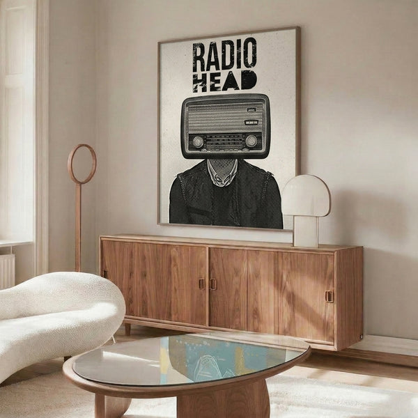 Retro pop art framed poster with surreal imagery of a figure whose head is replaced by a classic radio, executed in black, cream, and white.