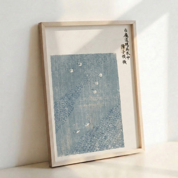Contemplative East Asian woodblock artwork depicting cranes in rain, done in muted slate blue and white with minimalist aesthetic.