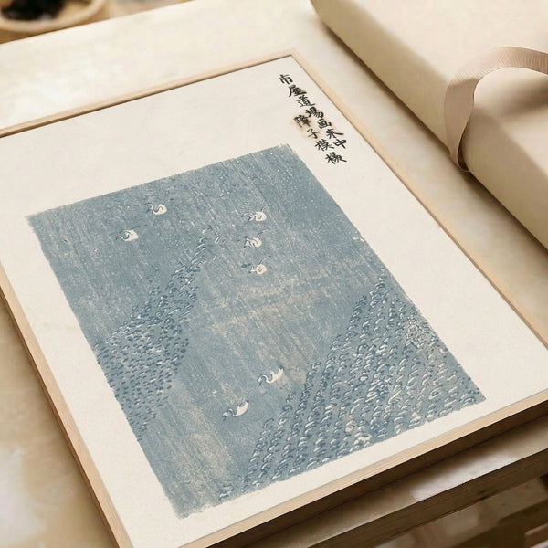 Serene framed print of cranes and water landscape in traditional East Asian ink wash style with soft blues, grays, and cream tones.