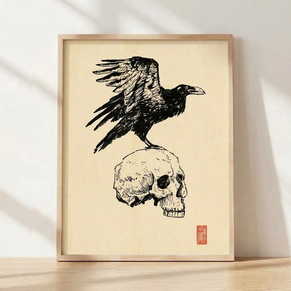 Minimalist line art print featuring a raven perched atop a skull in black and cream, evoking gothic and memento mori themes.
