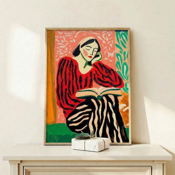 Modern line art print featuring a contemplative reader wearing a red striped sweater, framed on a wall with vibrant botanical elements in emerald and burnt orange against a cream background.