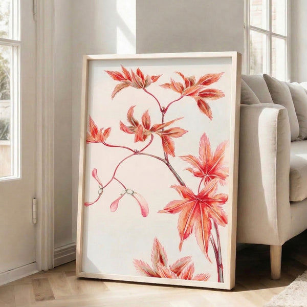 Naturalistic watercolor depiction of delicate maple leaves in warm coral, pink, and ochre shades, presented as a framed wall art piece.