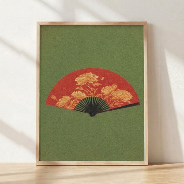 Elegant art nouveau poster featuring a crimson chrysanthemum blossom centered on a sage green fan with gold accents and black detailing, framed on a wall.