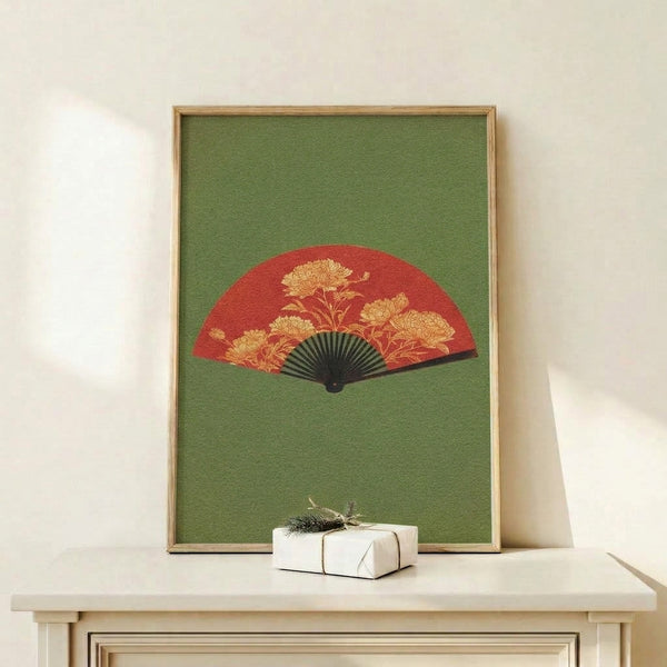 Vintage-inspired chinoiserie wall art depicting a golden chrysanthemum flower arranged on a decorative fan against a muted sage background with refined black linework.