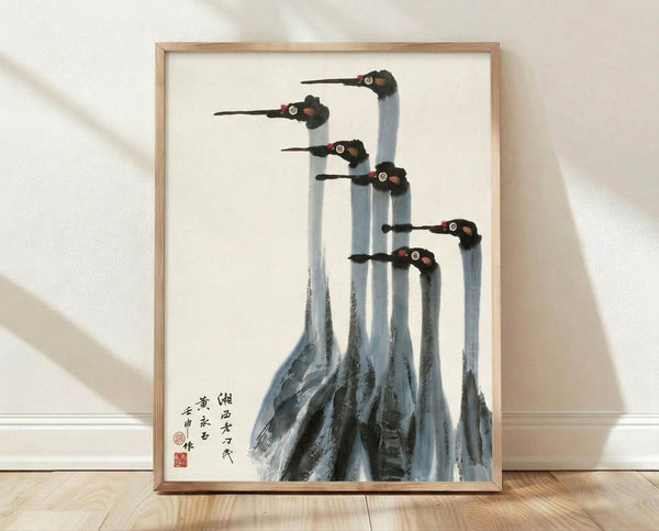 Seven cranes rendered in traditional sumi-e ink technique, minimalist brushstrokes in charcoal and black against cream background with subtle pale blue and crimson accents, serene Asian art print on wall.