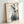 Minimalist crane art print in sumi-e style showing seven birds with delicate black ink lines, cream ground with touches of pale blue and crimson, zen-inspired wall art.