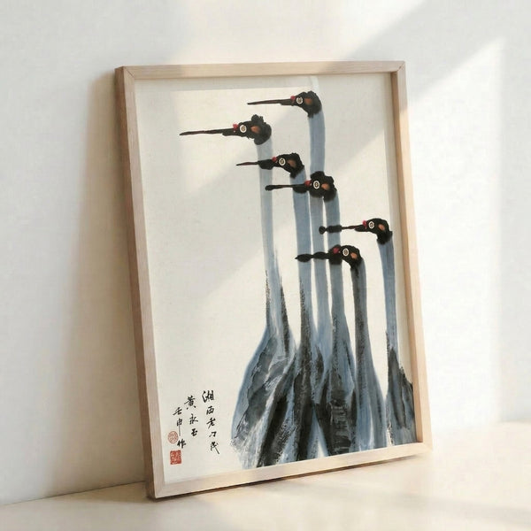 Minimalist crane art print in sumi-e style showing seven birds with delicate black ink lines, cream ground with touches of pale blue and crimson, zen-inspired wall art.