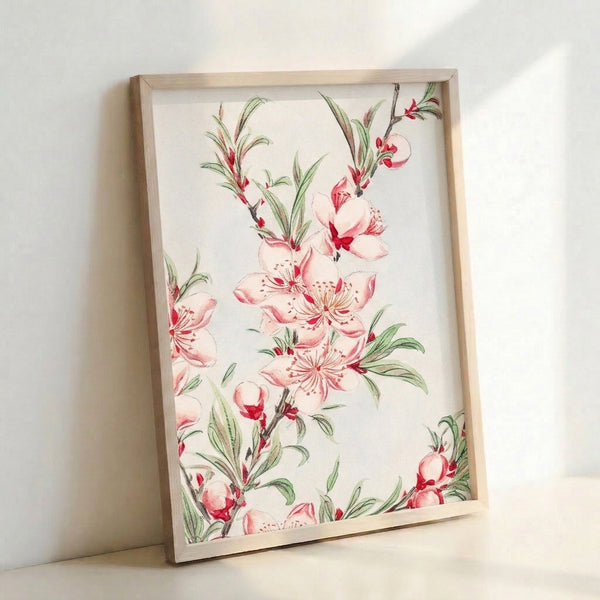Framed watercolor artwork displaying graceful peach blossoms with layered petals, green foliage, and natural brown branches in soft, romantic palette.