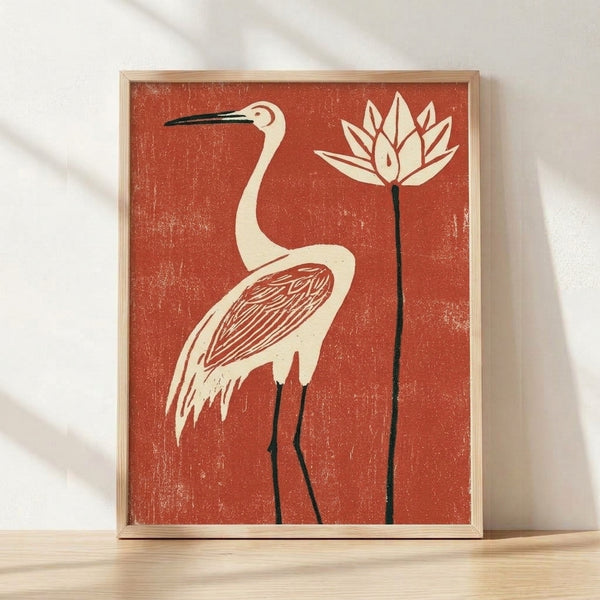 Japanese woodblock-style framed poster featuring a serene heron among lotus flowers in terracotta red, deep red, cream, and black line art.