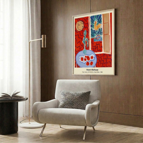 Vibrant minimalist wall art depicting a red interior with blue table elements, rendered in bold abstract shapes with striking color contrasts.