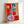Colorful still life artwork in warm reds and cool blues with abstracted domestic objects, reflecting Fauvist influence and decorative interior design aesthetic.