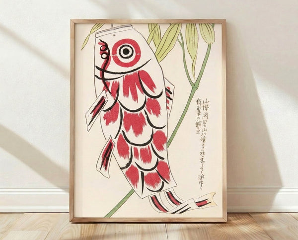 Framed Japanese woodblock print featuring red and cream koi fish swimming gracefully among green bamboo leaves and plant stems in folk art style.