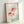 Serene aquatic scene art print showing two goldfish in contemplative composition with soft corals, greens, and whites in Japanese woodblock style.