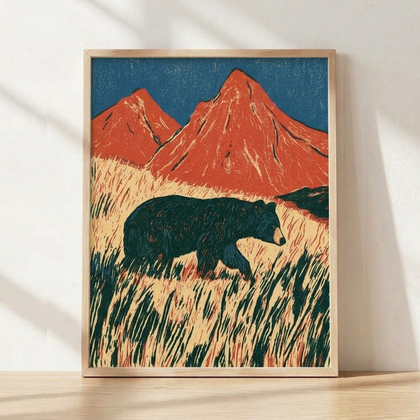 Framed Japanese woodblock print depicting a solitary bear in a teal and cream grassland beneath towering red volcanic mountains, rendered in vintage ukiyo-e style with majestic and contemplative mood.