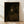 Framed portrait of Rembrandt's son Titus dressed as a monk, rendered in dark golden-age oil painting style with rich brown and ochre tones and dramatic shadow lighting.