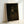 Antique-style framed artwork depicting Titus in monk's habit, painted with Rembrandt's signature dark academic aesthetic and luminous brushwork in browns, golds, and deep shadows.