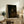 Framed dark academia wall art featuring Rembrandt's portrait of his son as a monk, showcasing layered shadows and golden-brown hues characteristic of 17th-century Dutch painting.
