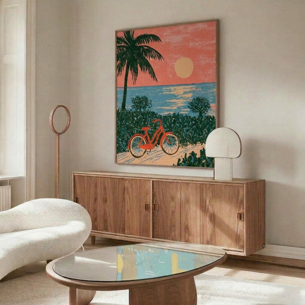 Summery vintage-inspired beach poster showing a bicycle and cactus under palm trees at dusk, with a dreamy teal and golden sunset palette.