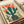 Framed poster showcasing a stylized desert cactus garden with cream, sage green, and coral red florals in a playful retro aesthetic.