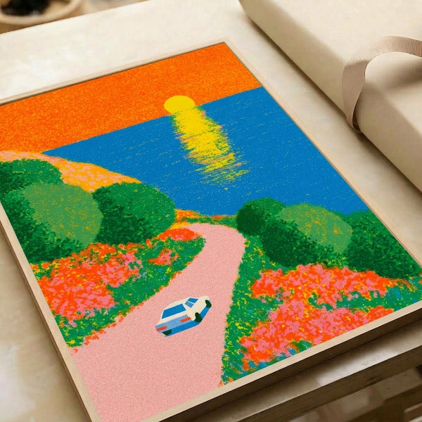 Mid-century modern art print depicting a nostalgic road trip scene with a vintage automobile, coastal cliffs, blooming flowers, and a vibrant sunset in blue, orange, and green tones.