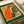Minimalist folk art wall print depicting a cheerful orange fox with a coffee cup, combining cozy retro design elements in forest green and cream tones.