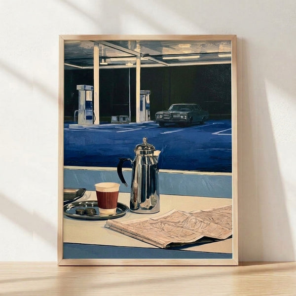 Retro gas station and diner scene with vintage car, coffee cup, and newspaper in deep blue, cream, and metallic silver tones; nostalgic Americana art print framed on wall.