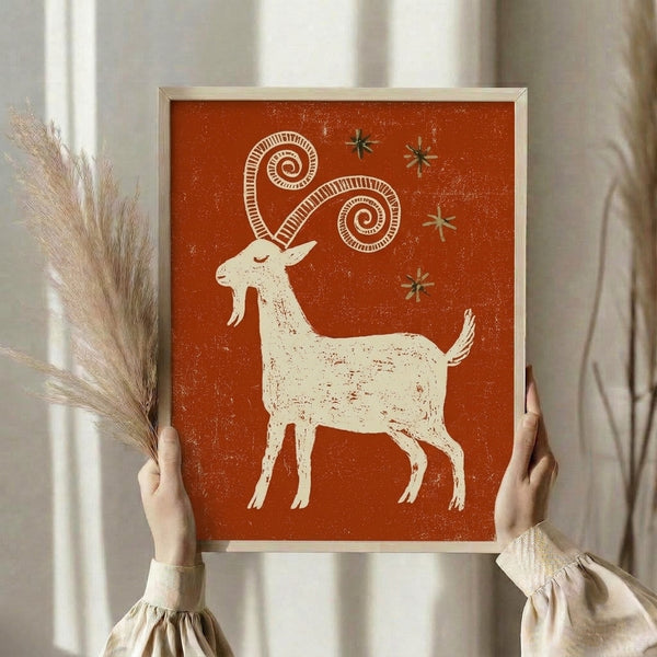 Retro vintage-style goat constellation art print with playful stars and swirling designs in warm earth tones, displayed as framed wall decor.