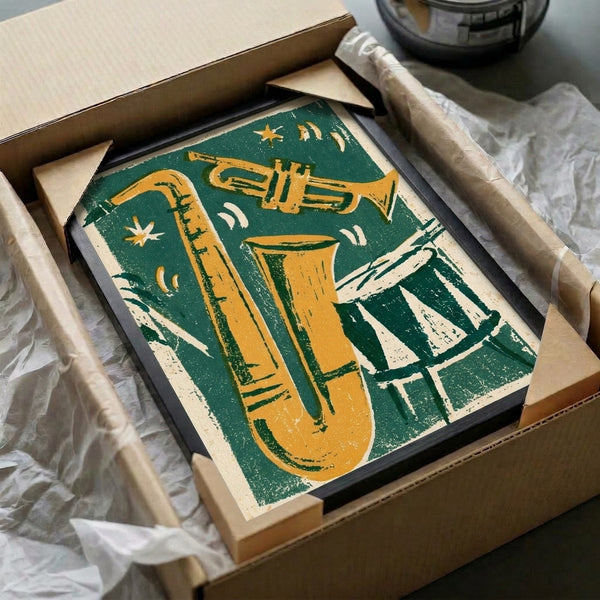Framed vintage jazz artwork in bold linocut style showing an ensemble of instruments and musicians with moon and star motifs in cream, charcoal, and golden tones on a wall.